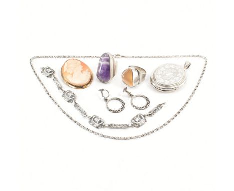 An assorted collection of silver jewellery. The lot to include; yellow stone set ring, gold tone cameo brooch pin, spiral fla