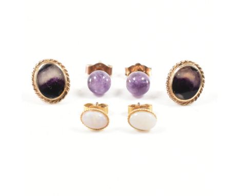 Three pairs of 9ct yellow gold stone set stud earrings. The lot to include a pair of oval blue john cabochon twisted mount st