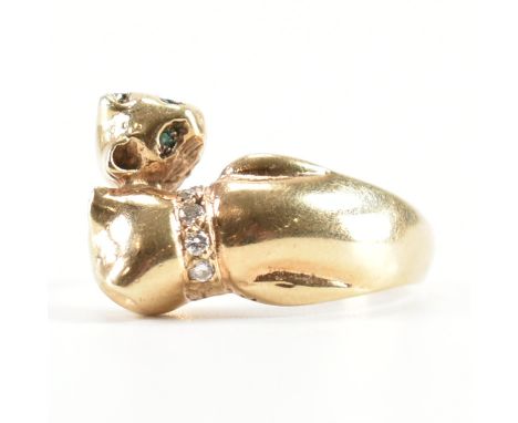 A hallmarked 9ct gold cat design crossover ring. The ring in the form of two cats set with coloured stones in wrap around for