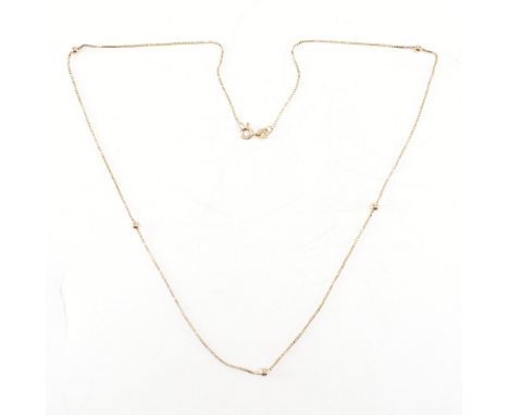 A hallmarked 9ct yellow gold box chain necklace. The chain comprised of predominantly box links &amp; having five gold beads 