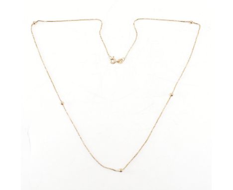 A hallmarked 9ct yellow gold box chain necklace. The chain comprised of predominantly box links &amp; having five gold beads 