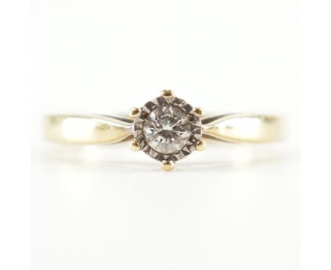 A hallmarked 9ct gold and diamond solitaire ring. The ring being illusion set with a round cut diamond. Import marked Sheffie