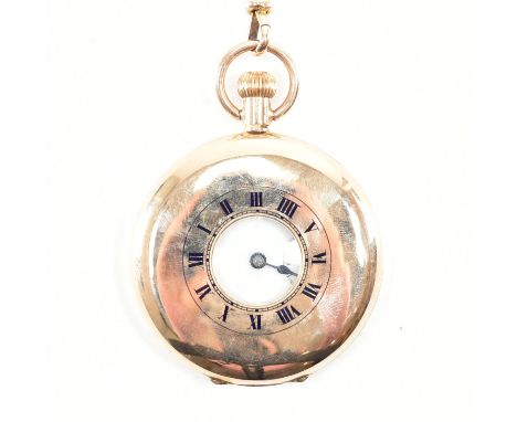 A hallmarked 9ct yellow gold half hunter pocket watch. The watch having a circular white dial with Roman numeral indices &amp