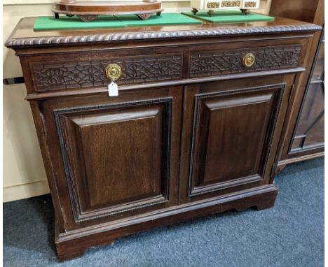 A pair of late 19th / early 20th century mahogany bookcases with blindfret frieze above two glazed panel doors enclosing thre