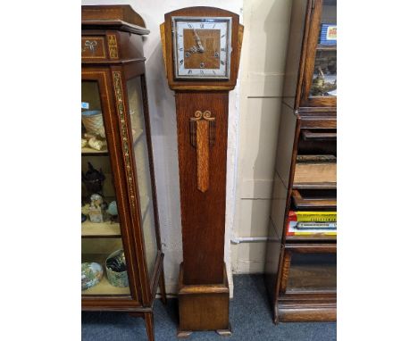 A 20th century Enfield oak cased grandmother clock, with Westminster chimes, 143cm high, with key