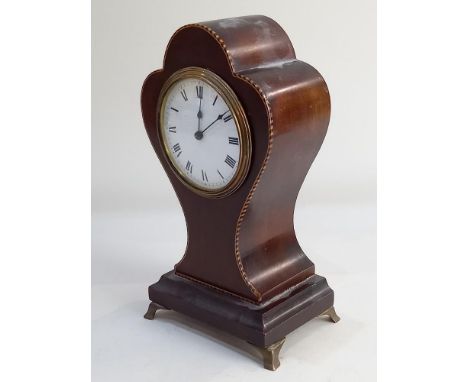 An Edwardian balloon shaped mantle clock white dial with Roman numerals on plinth base and metal feet, 24cm high