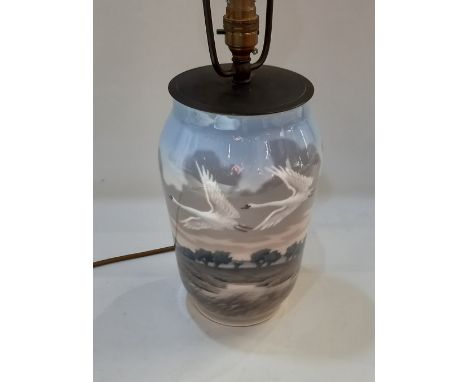 A Royal Copenhagen porcelain table lamp decorated with flying swans, 25.5cm high