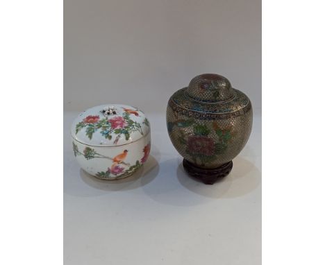 A Chinese porcelain pot and cover, decorated with character marks, and birds amongst flowers on white ground, faint seal mark