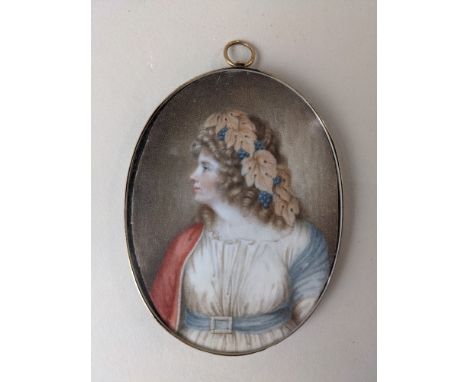 An 18th/19th century portrait miniature of a lady with grapes and leaves in her hair, oval, 8.5cm by 6.5cm, in unmarked gold 