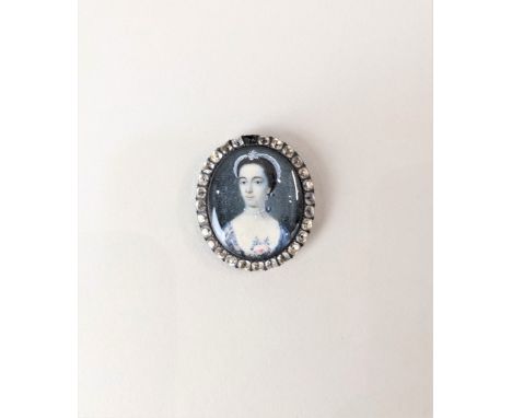 An 18th century oval portrait miniature of a lady with a pearl necklace and pink rose, possibly by Thomas Redmond, initialled