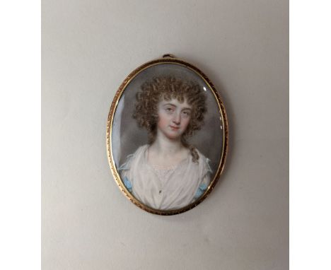 John Smart (1741-1811), portrait miniature of a young lady wearing a blue and white dress, signed and dated 1789 I, oval, 6.5