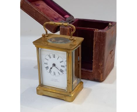 A brass and bevelled glass cased carriage clock, the dial marked J C Vickery, to their Majesties, 179-183 Regent St, 15cm hig