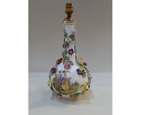 A Dresden porcelain bottle shaped vase (converted to a table lamp), decorated with figures in a landscape and a posy of flowe