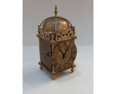 A braas lantern style mantle clock, circular engraved dial marked T May Sudbury with bell strike movement, 23cm