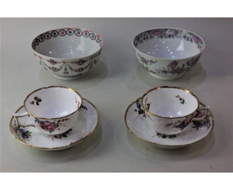 A pair of Spode porcelain tea cups and saucers with moulded floral decoration and gilt borders together with two circular por