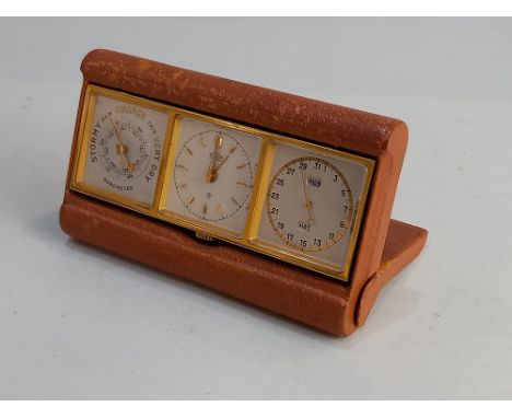 An Angelus 'Threesome' gilt metal three dial travel set of clock, barometer and calendar in brown leather case with tooled gi