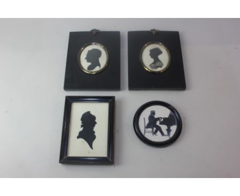 Three 19th century portrait silhouettes, of two ladies and a young man wearing a cap, largest 11.5cm by 7.5cm, together with 