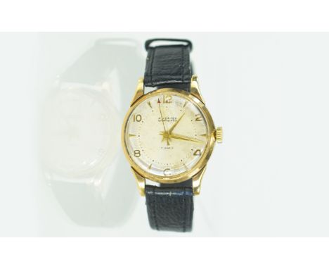 A Gents 9 Carat Gold Wrist Watch Vintage watch with original black/brown leather strap, white ceramic dial and gold numerals.