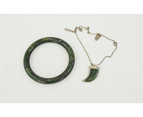 Jade Bangle. Together with a Silver Mounted Jade Pendant In The Form of a Horn with An Attached Silver Chain. 