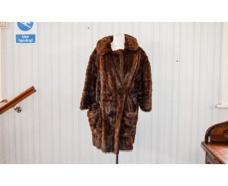 Vintage Mink Coat Ladies Three quarter fur coat with revere collar, front patch pockets and hook and eye closure with faux bu
