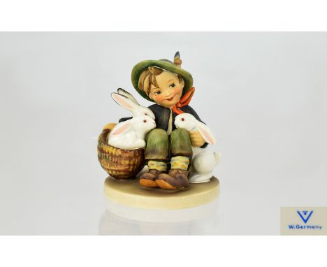 Hummel Figure 'Playmates' Goebel West Germany figure of small boy in Tyrolean dress with a basket of three white rabbits. Mar