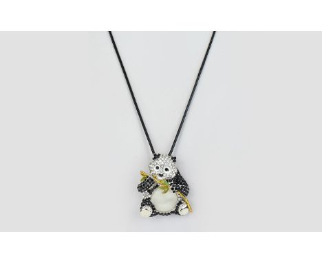 Enamel, Crystal and 'Cat's Eye' Panda Pendant or Brooch, a black and white enamelled, seated panda, set with white and black 