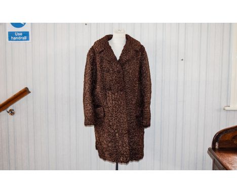 Astrakhan Vintage Coat Three quarter brown Persian lamb coat, front patch pockets, revere collar and covered button fastening