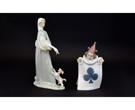 A Lladro Figure of a Young Girl Carrying a Goose, with a Little Dog by Her Feet. 10.5 Inches High. Model No 4866. Issued 1974