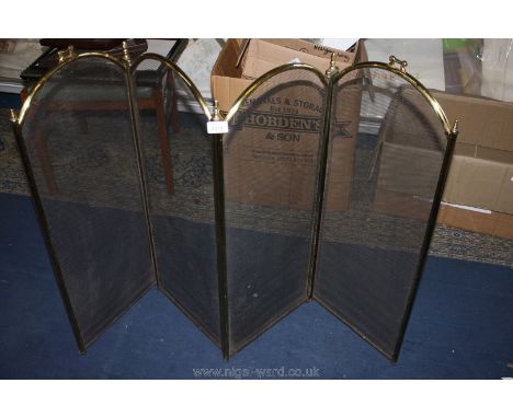 A four fold Brass fireguard