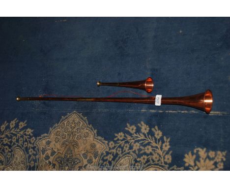 A small hunting Horn and a long hunting Horn.