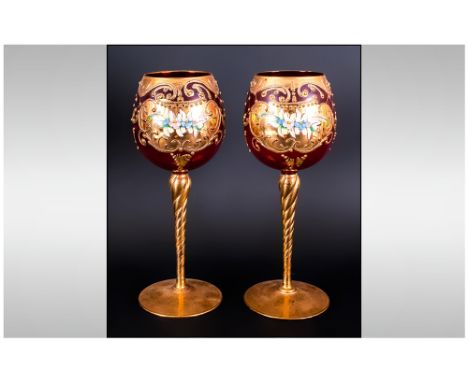 Pair Of Ruby Glass Murano Hock Glasses decorated in thick gold leaf with coloured enamel flowers.