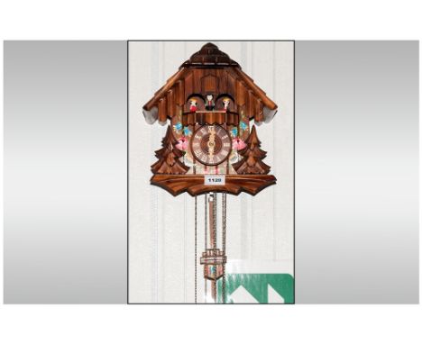 German Black Forest Musical Triple Weighted Cuckoo Clock Of Typical Form With Painted Floral Decoration And Moving Figures 