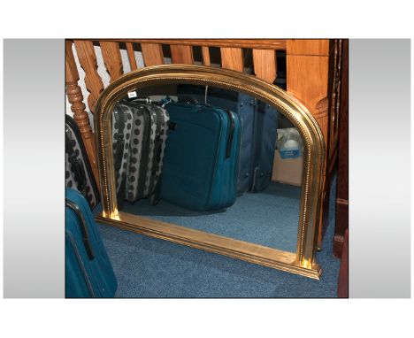 Shaped Domed Top Giltwood Overmantle with a beaded frieze supported by an under shelf. 31'' in height, 42'' in width.