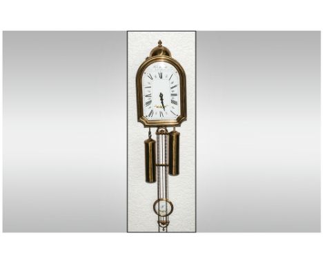 A Reproduction Brass Wall Clock with enamel dial. Maker Dupont A St Denis.