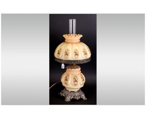 Continental Glass Lamp Decorated With Flowers With A Bulbous Body and matching shade in glass. In gilt metal mounted on a roc