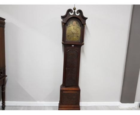 A 19TH CENTURY CARVED OAK LONGCASE CLOCK BY R FOSTER CARLISLE HANDPAINTED MOON AND SUN ABOVE BRASS ROMAN DIAL 221CM HIGH