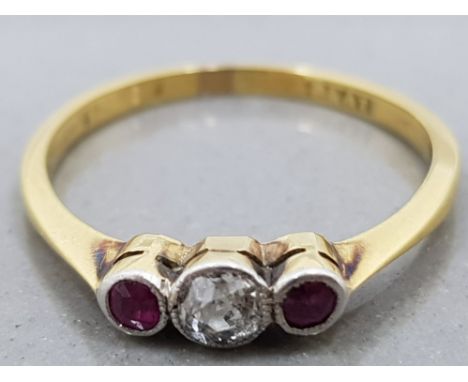 A 9CT YELLOW GOLD AND PLATINUM RUBY AND DIAMOND THREE STONE RING HALLMARKS RUBBED SIZE L 1.7G GROSS