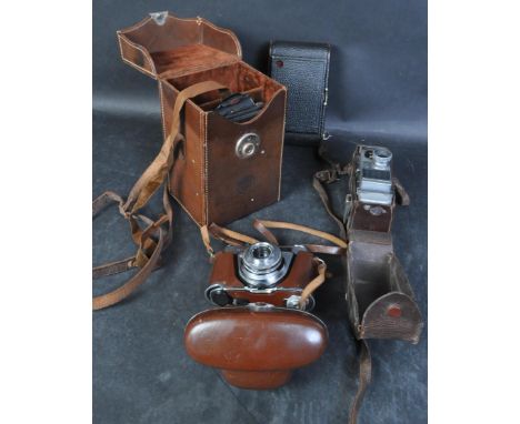 A collection of four vintage 20th century camera &amp; binoculars GB Belle Howell,&nbsp; Kodak Box Brownie, Belvedere Binocul
