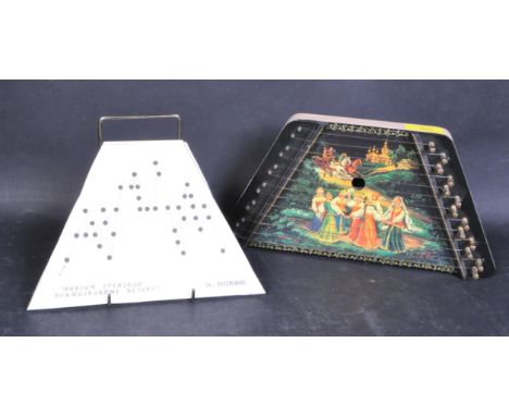 A vintage 20th Century octave zither. Having two sheet notes to follow and play. Wooden body and painted dancing scene with s