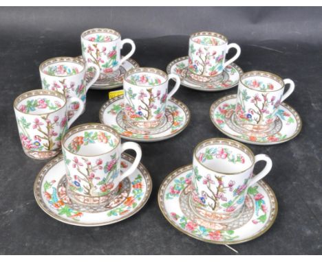 An early 20th century Coalport china coffee service comprising of cups and saucers. The cups having polychrome floral decorat