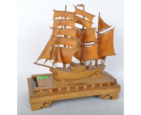 A vintage mid 20th Century bamboo boat box figurine. The junk ship modelled from bamboo, mounted on a sliding lid on carved w