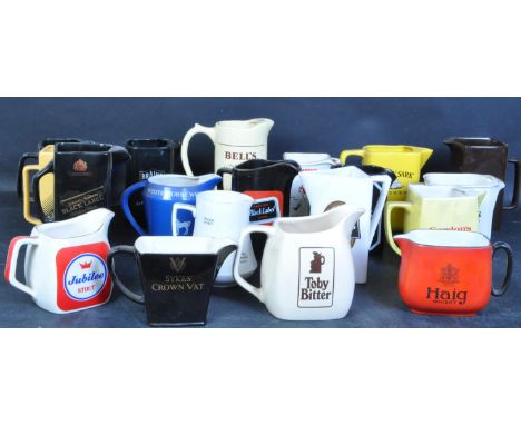 A large collection of vintage 20th century whisky jugs to include the brands silk cut, Worthington, Gordons Gin, Brains, Cutt