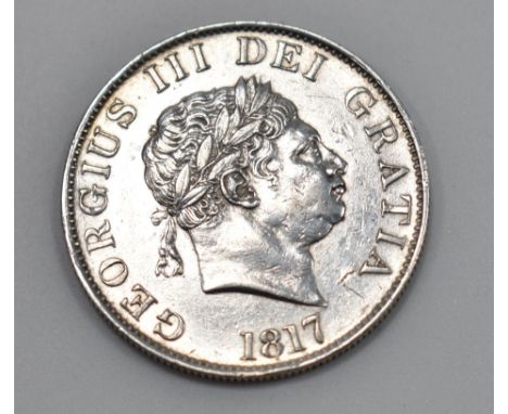 An early 19th century King George III .925 silver half crown having smaller laureate head of George III facing right, with la