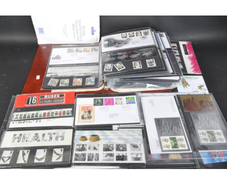 A collection of 20th century post-decimal stamp unfranked presentation packs alongside a quantity of franked first day covers