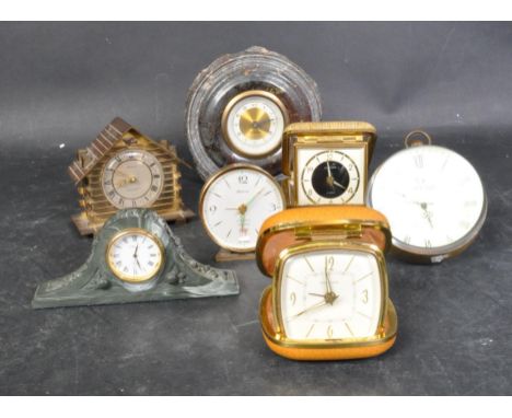 An assortment of vintage 20th century clocks to include a pair of collapsible cased travel clocks to include Europa and Estym