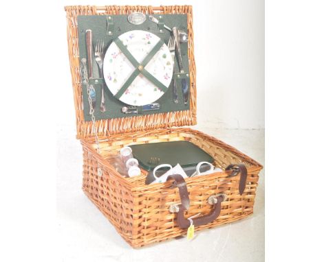 A vintage retro late 20th century Brexton Collection wicker picnic basket set. The set includes plates, cups, cutlery, thermo