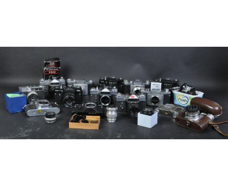 An assortment of vintage 20th century cameras, lenses and photographic camera repairs and spares pieces Praktiflex, a Zenit-E