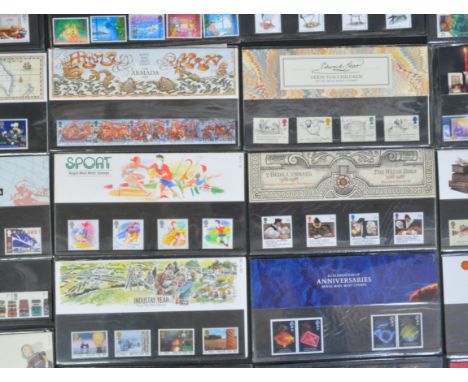 A collection of approx 80 Royal Mail mint First Class presentation packs to include Industry Year, The Linnean Society, Welsh