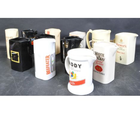 A collection of vintage 20th century whisky jugs to include Special Old Whisky, Macphersons Cluny, Hankey Bannister, Bells, P