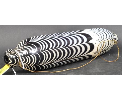 A Victorian 19th century Nailsea glass rolling pin with opaque bright black &amp; white striped decoration. It measures appro